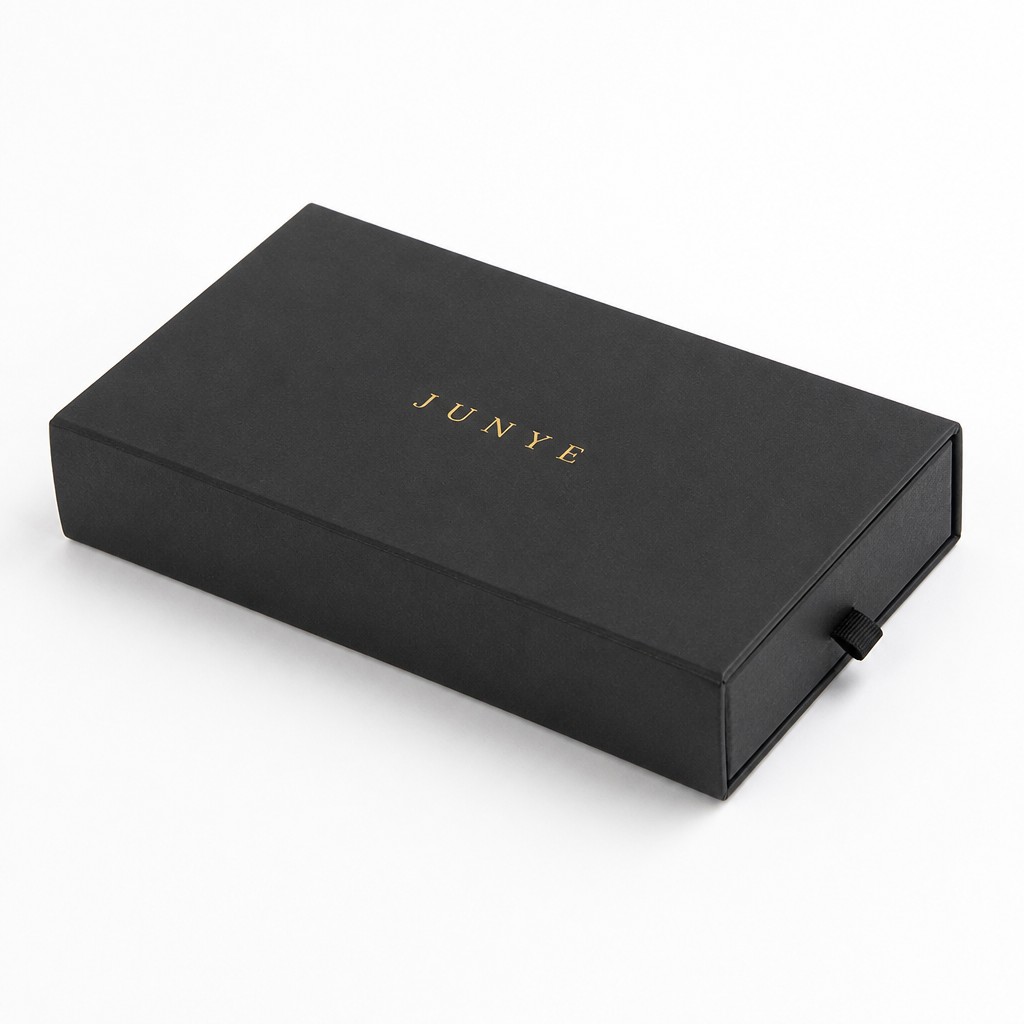 Flat black single-end drawer box closed, with the ribbon pull on the front face