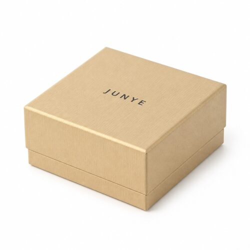 Closed gold lid and base gift jewelry package with the JUNYE logo on the lid