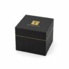 Black cube magnetic jewelry box closed, with the gold hairline running along the seam between lid and base