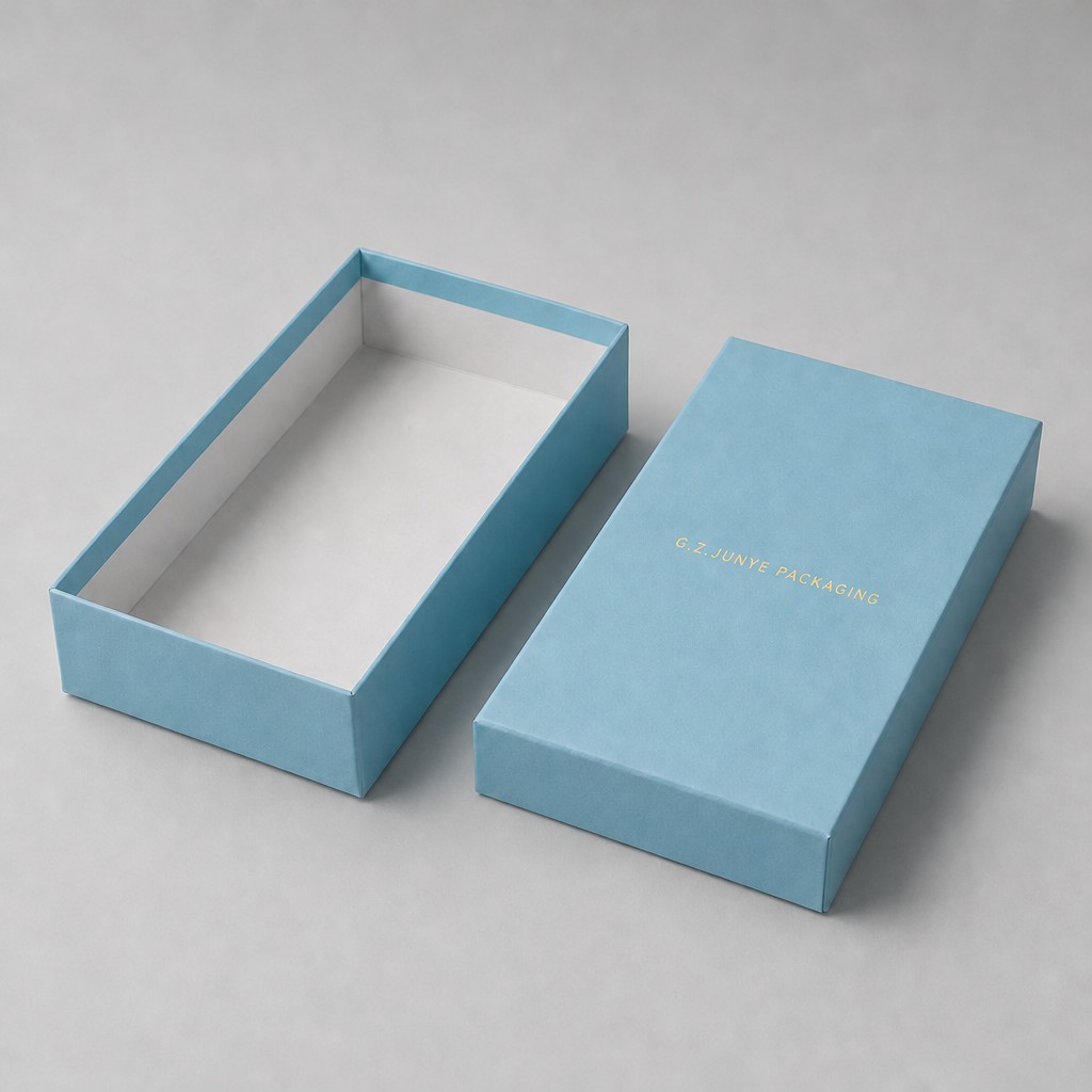 Open blue eyewear box with the lid set aside, flat light grey liner and blue edge along the mouth