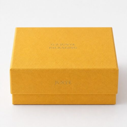 Front view of the closed gold embossed rigid box and the lid seam