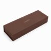 Closed long brown gift set jewelry packaging box with a gold foil JUNYE mark on the lid