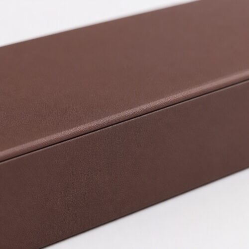 Close up of the lid seam and wrapped edge on a long brown flip box