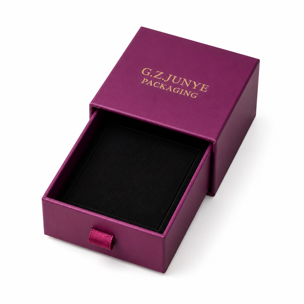Magenta drawer box with the tray pulled out, showing the plain black flocked liner and no compartments