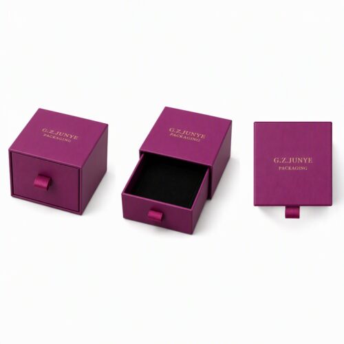 Four views of the magenta drawer jewelry box: closed, drawer slid out, and the tray shown on its own