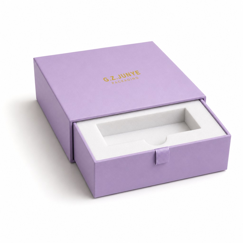 Purple drawer box with the tray pulled 30 percent out, the white foam insert and its main cavity visible