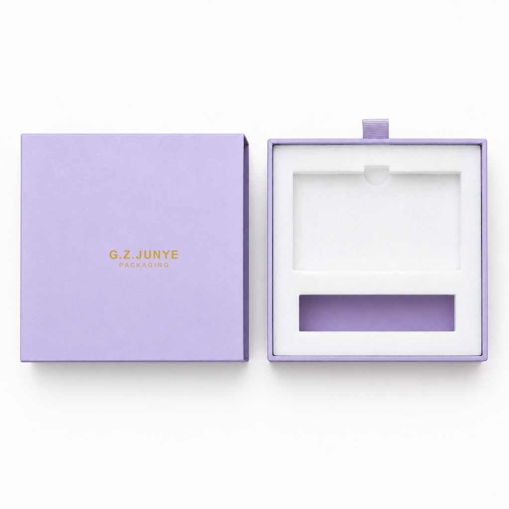 Purple drawer box with the tray slid fully out of the sleeve, showing the white foam insert cut flush with the tray mouth