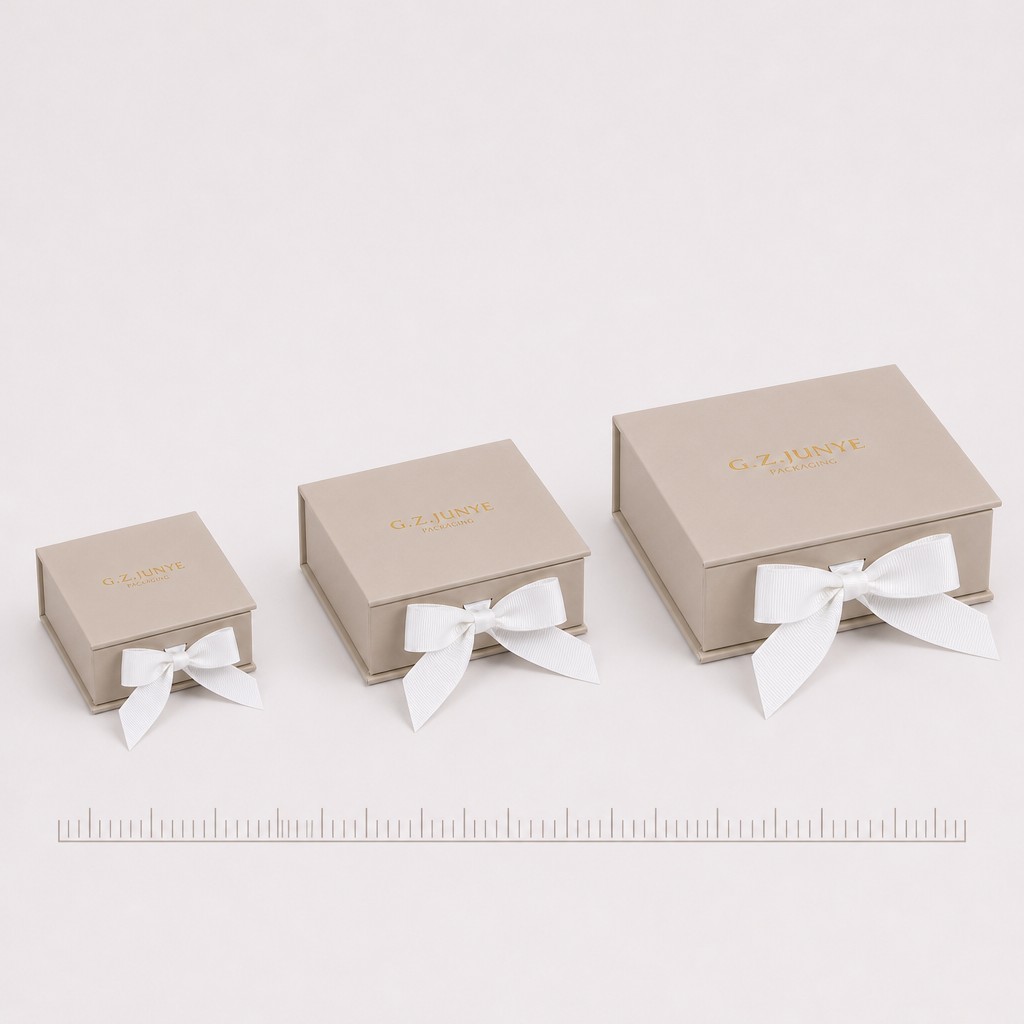 Ribbon options for a beige flip box: white grosgrain, brown and grey ribbon on request, plus custom sizes