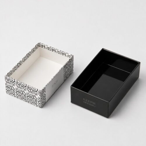 Two parts of the telescopic lid box side by side showing the mitred corner folds